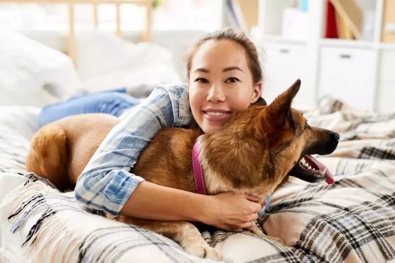 woman spending time with her dog
